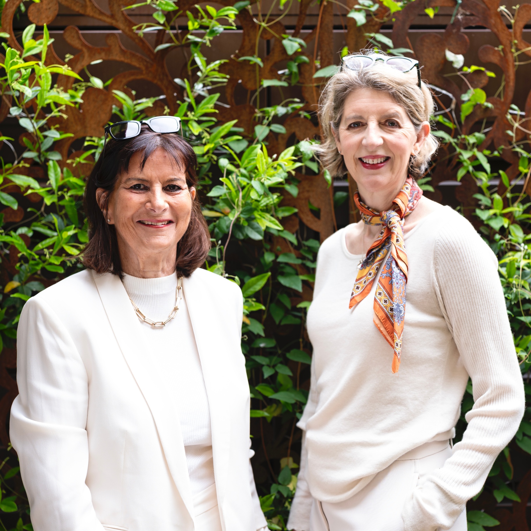 Victoria Tomlinson and Louise Ballard in a garden setting